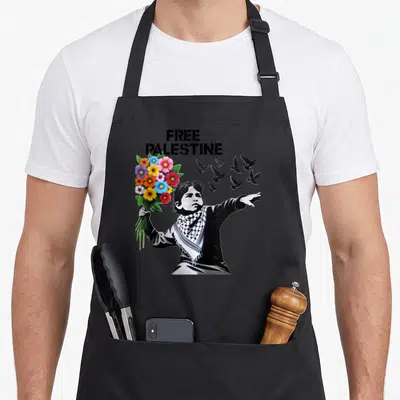 Tablier de cuisine noir avec Free Palestine, enfant aux fleurs et pigeons en silhouette noire.