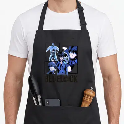Tablier de cuisine noir avec Yoichi Isagi, le logo Blue Lock et des vignettes d'action en bleu et noir.