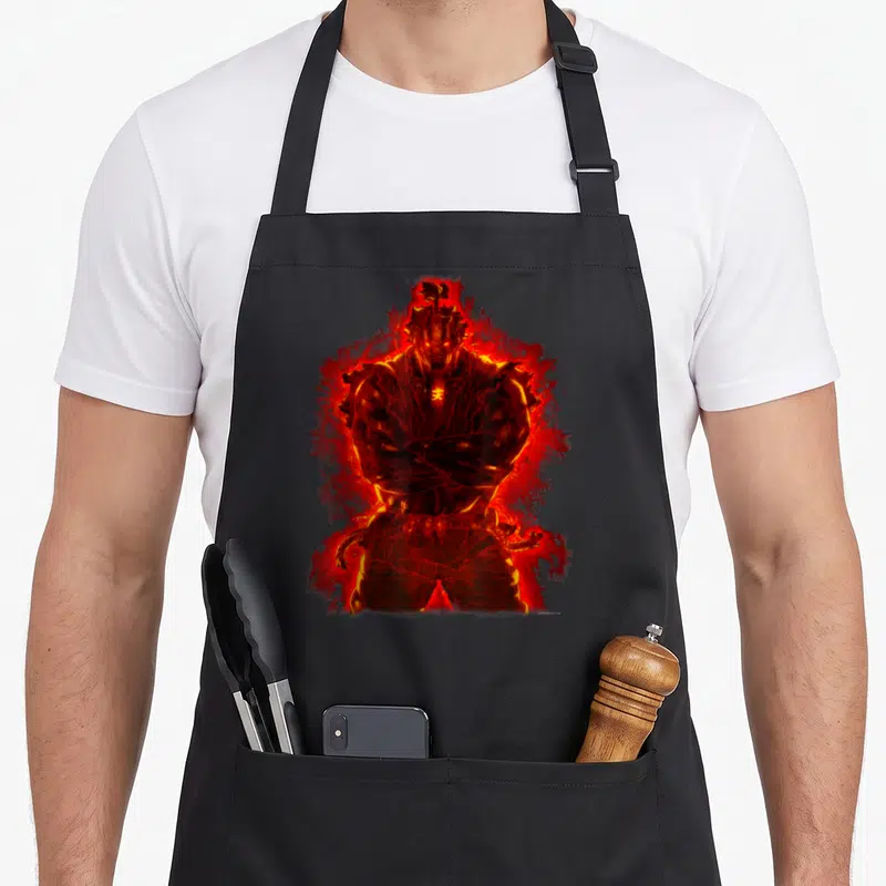 Tablier de cuisine noir avec illustration d'Akuma enveloppé dans une aura rougeoyante du Satsui no Hado.
