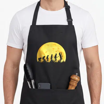 Tablier de cuisine noir avec silhouette evolution chanteuse Singer Sängerin sur fond de soleil jaune et orange.