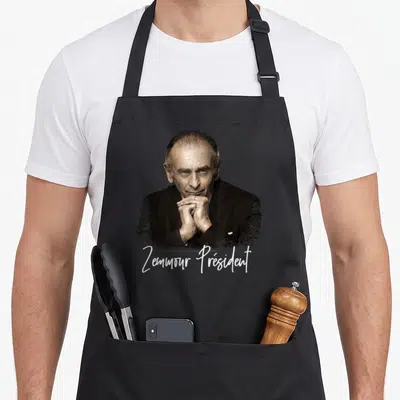 Tablier de cuisine noir avec portrait d'homme et inscription Zemmour Président en écriture blanche manuscrite.