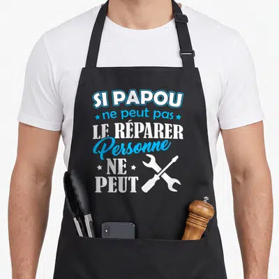 Tablier de cuisine noir avec inscription blanche et bleue Si Papou ne peut pas le réparer personne ne peut et outils croisés.