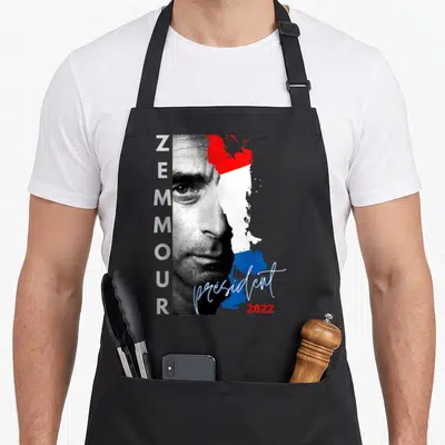 Tablier de cuisine noir avec portrait stylisé Zemmour, drapeau tricolore et texte président 2022 en calligraphie bleue.