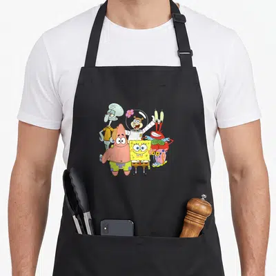 Tablier de cuisine noir avec illustration colorée du groupe d'amis de la série animée sous-marine.