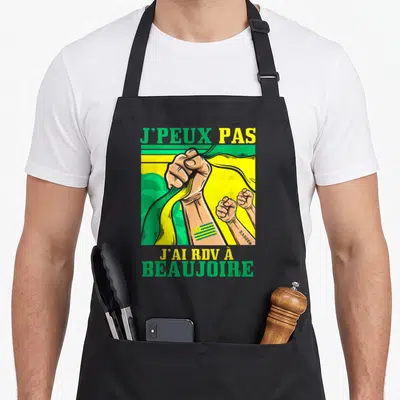 Tablier de cuisine noir avec illustration de poings serrés et texte J'peux pas j'ai rdv à Beaujoire en vert et jaune.
