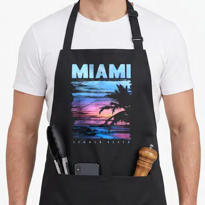 Tablier de cuisine noir avec illustration sunset Miami, palmier et texte Summer Beach en bas.