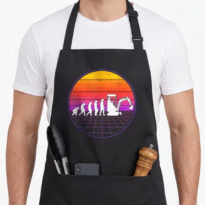 Tablier de cuisine noir avec illustration évolution humaine vers pelleteuse sur fond dégradé rétro.