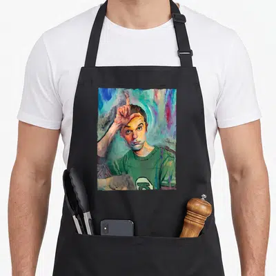 Tablier de cuisine noir avec portrait peint de Sheldon le doigt levé sur fond coloré abstrait