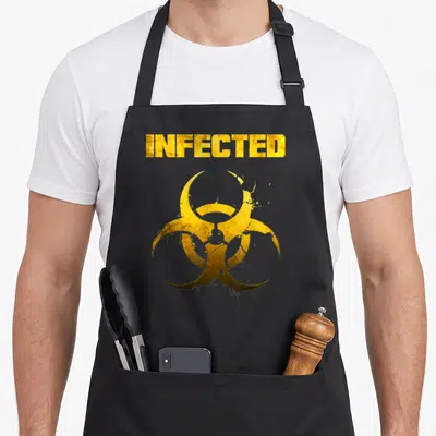 Tablier de cuisine noir avec le texte Infected et un symbole biohazard jaune texturé au centre du torse.