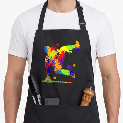 Tablier de cuisine noir avec silhouette de parkour aux couleurs vives et éclats de peinture artistique.