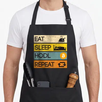 Tablier de cuisine noir avec quatre bandes colorées portant les mots Eat Sleep Hodl Repeat accompagnés d'icônes thématiques.
