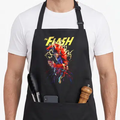 Tablier de cuisine noir avec le Flash en décomposition et éclairs jaunes.