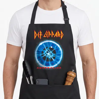 Tablier de cuisine noir avec le logo Def Leppard rouge et une illustration circulaire électrique bleue centrée sur le devant.