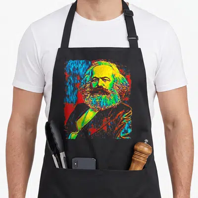 Tablier de cuisine noir avec portrait stylisé en couleurs vives de Karl Marx sur fond abstrait.