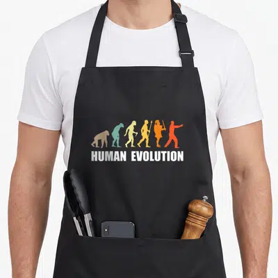 Tablier de cuisine noir avec silhouettes colorées évolution humaine et texte Human Evolution en blanc.