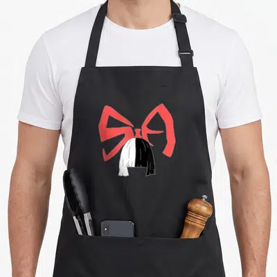 Tablier de cuisine noir avec illustration d'un chignon noir et blanc et un grand nœud rose derrière.