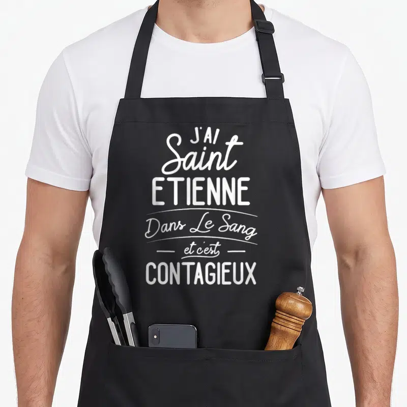 Tablier de cuisine noir avec inscription blanche J'ai Saint Etienne dans le sang et c'est contagieux typographie mixte.