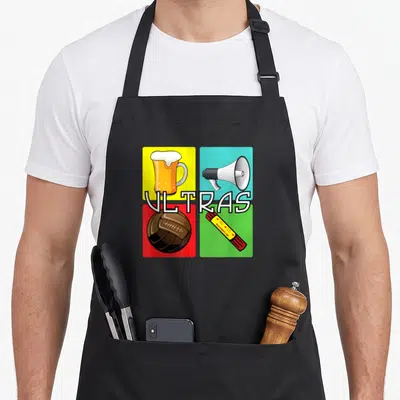 Tablier de cuisine noir avec une bière, un mégaphone, un ballon de rugby et un sifflet sur fond quadricolor.