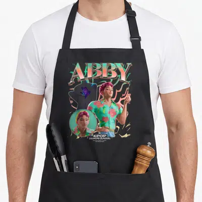 Tablier de cuisine noir avec illustration colorée d'Abby et texte Kpop Demon Hunters