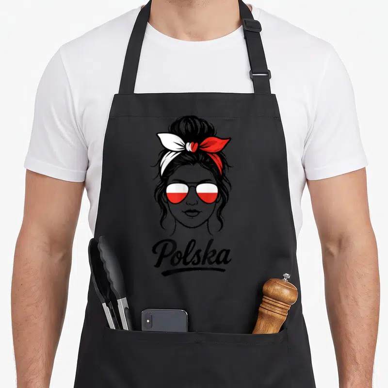 Tablier de cuisine noir avec illustration femme aux lunettes drapeau polonais et texte Polska en bas.