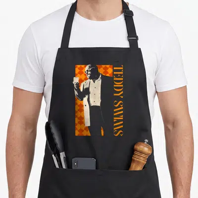 Tablier de cuisine noir avec illustration de Teddy Swims tenant un verre sur fond orange géométrique