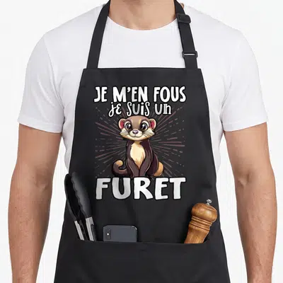 Tablier de cuisine noir avec illustration d'un furet mignon et le texte Je m'en fous je suis un furet en blanc.