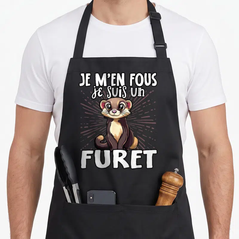 Tablier de cuisine noir avec illustration d'un furet mignon et le texte Je m'en fous je suis un furet en blanc.