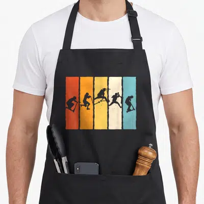 Tablier de cuisine noir avec cinq bandes verticales colorées affichant des silhouettes de trottinette freestyle en action.