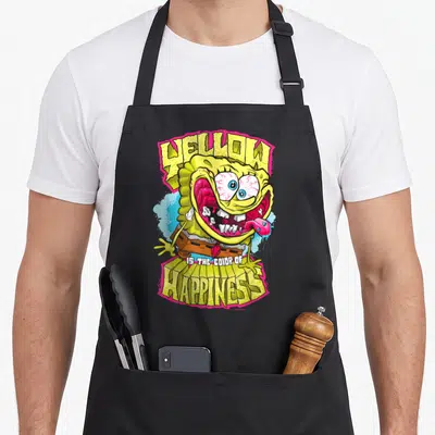 Tablier de cuisine noir avec illustration de Sponge Bob aux yeux exorbités et texte Yellow Is The Color Of Happiness.