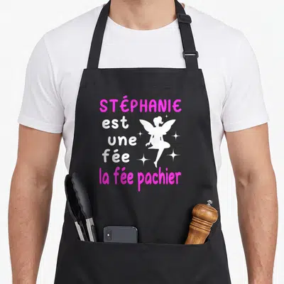 Tablier de cuisine noir avec inscription Stéphanie est une fée la fée pachier et silhouette rose d'une fée.