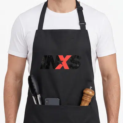 Tablier de cuisine noir avec le logo INXS en noir et rouge, lettre X traversée d'une étoile blanche.