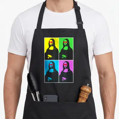 Tablier de cuisine noir avec La Joconde pop art portant des lunettes rouges sur quatre fonds colorés distincts.