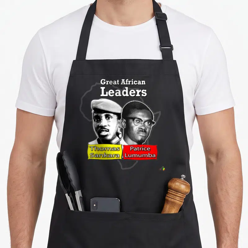 Tablier de cuisine noir avec portraits de Thomas Sankara et Patrice Lumumba et texte « Grands Leaders Africains ».