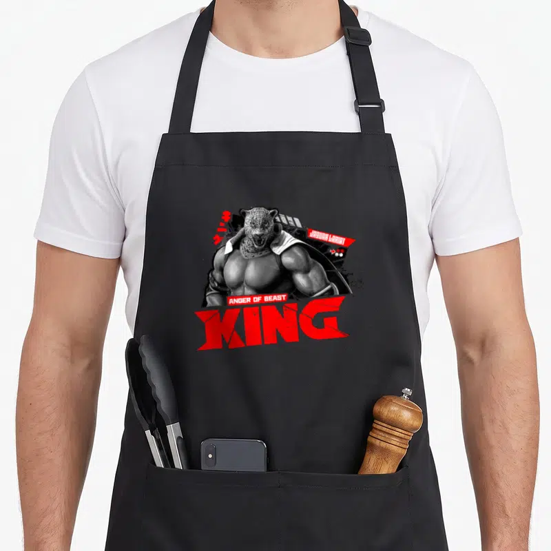 Tablier de cuisine noir avec illustration de King, Anger of Beast et Jaguar Lariat en rouge et noir.