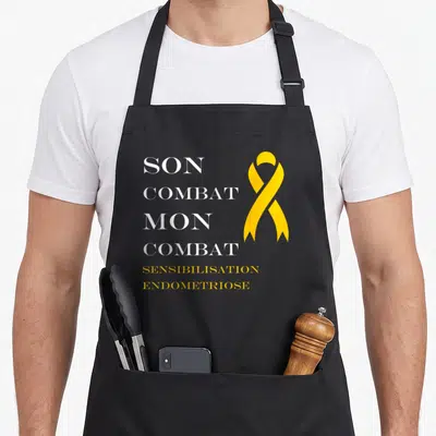 Tablier de cuisine noir avec texte blanc et ruban jaune sensibilisation endométriose