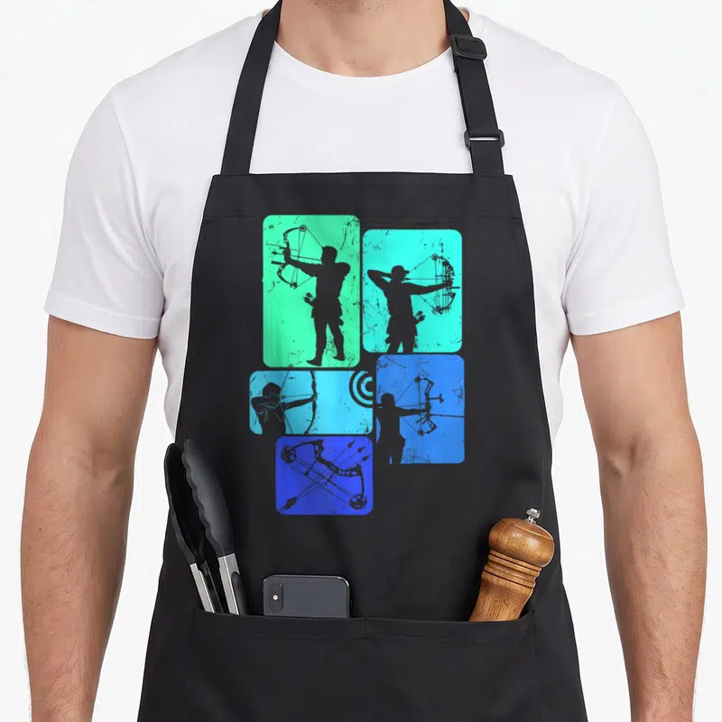 Tablier de cuisine noir avec silhouettes d'archers et arcs en vert et bleu sur fonds rectangulaires texturés.