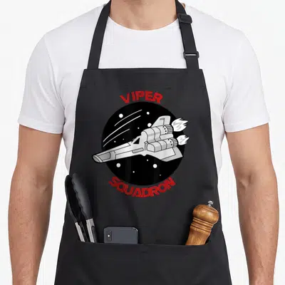 Tablier de cuisine noir avec un vaisseau spatial blanc et les mots VIPER SQUADRON en rouge.