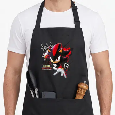 Tablier de cuisine noir avec Shadow le Hérisson en action et le logo Sonic X Shadow Generations.