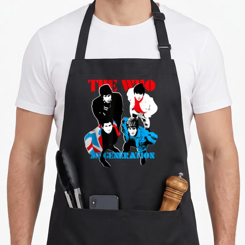 Tablier de cuisine noir avec illustration colorée du groupe The Who et le texte My Generation en bas.