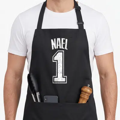 Tablier de cuisine noir avec l inscription Nael 1 en blanc style maillot de sport dégradé
