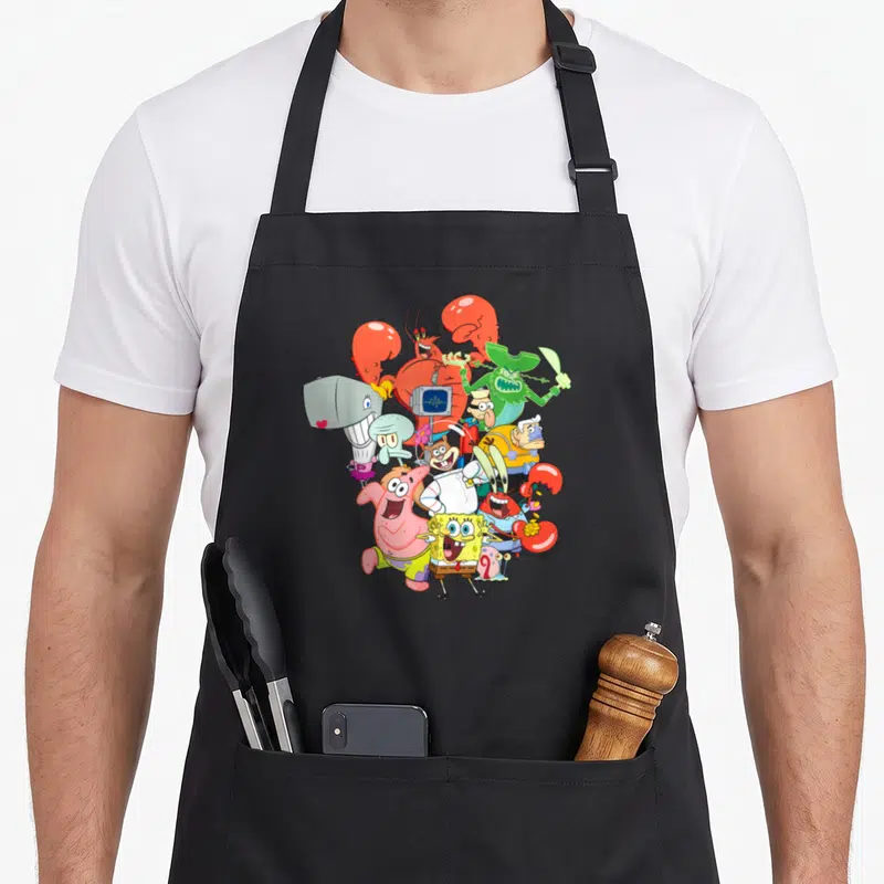 Tablier de cuisine noir avec illustration colorée regroupant SpongeBob, Patrick et les personnages de la série animée.