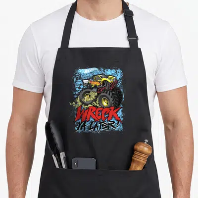 Tablier de cuisine noir avec un monster truck jaune Hot Wheels et l'inscription Wreck Ya Later en lettres rouges et noires.
