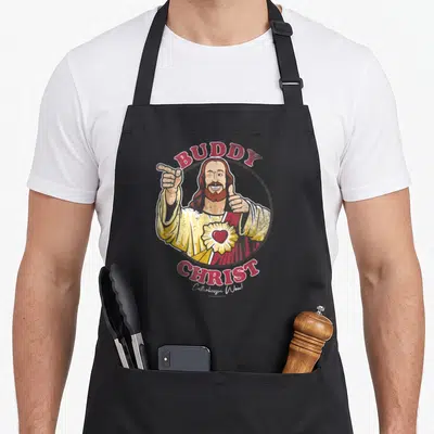 Tablier de cuisine noir avec illustration du Buddy Christ pointant vers le haut et le bas.