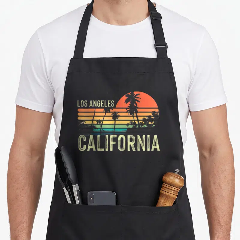 Tablier de cuisine noir avec illustration Los Angeles California et palmiers au coucher du soleil