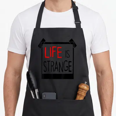 Tablier de cuisine noir avec un motif rectangulaire imitant une affiche collée par des bandes noires.