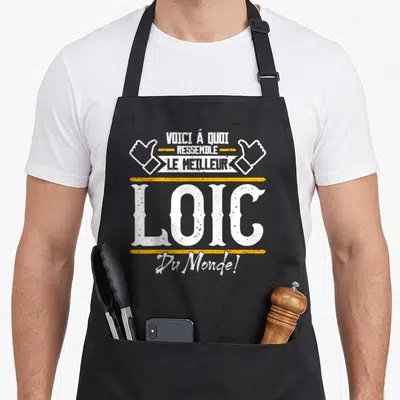 Tablier de cuisine noir avec inscription Voici à quoi ressemble Le meilleur Du Monde et deux mains en air de Loïc.
