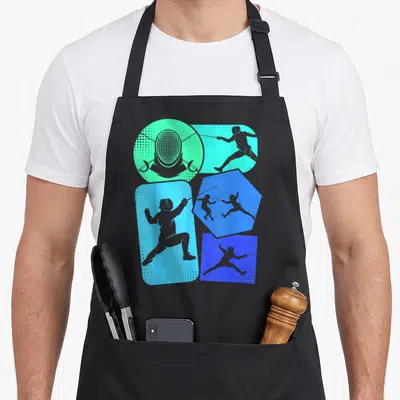 Tablier de cuisine noir avec motifs graphiques représentant des silhouettes d'escrimeurs et un masque d'escrime en bleu et vert.