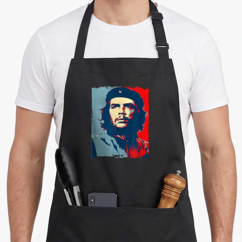 Tablier de cuisine noir avec portrait graphique de Revolution Ernesto Che Guevara en bleu et rouge.