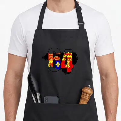 Tablier de cuisine noir avec le chiffre 64 et des armoiries régionales colorées superposées à une silhouette géographique.
