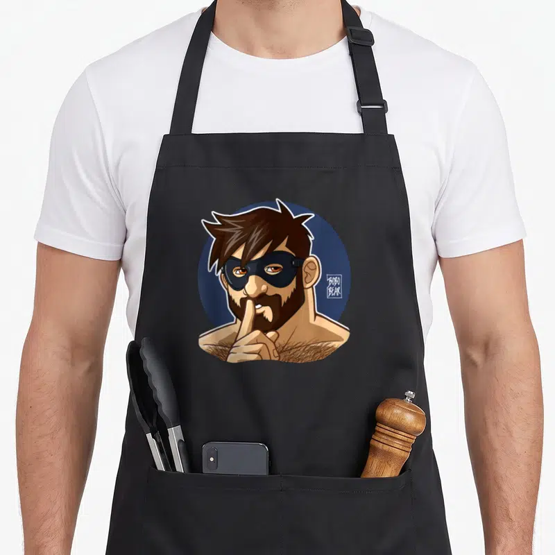 Tablier de cuisine noir avec illustration d'un homme barbu masqué posant un doigt sur ses lèvres.